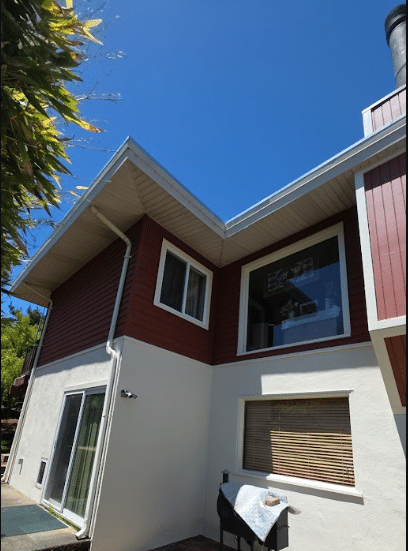 Exterior stucco and siding project by McCarthy Painting