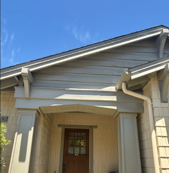 Entry porch trim and gutter work by McCarthy Painting