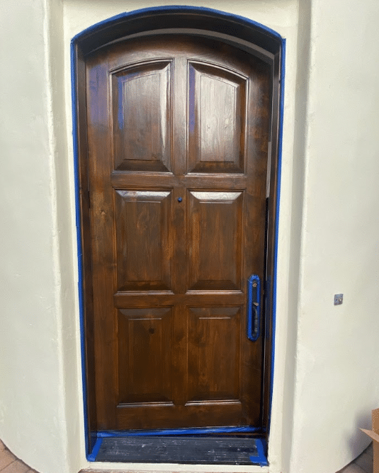Refinished wood entry door by McCarthy Painting