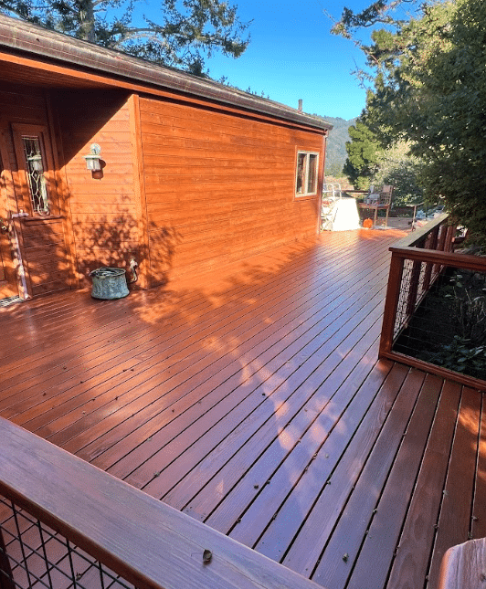 Wood deck and siding staining project by McCarthy Painting