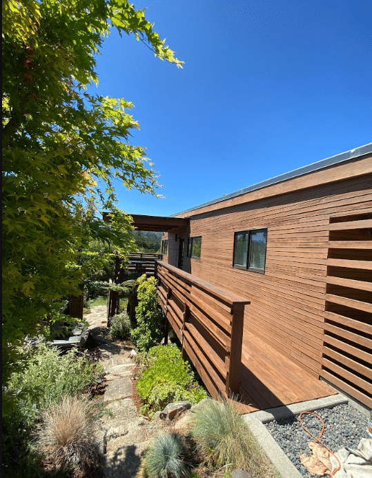 Wood siding restoration and staining project by McCarthy Painting