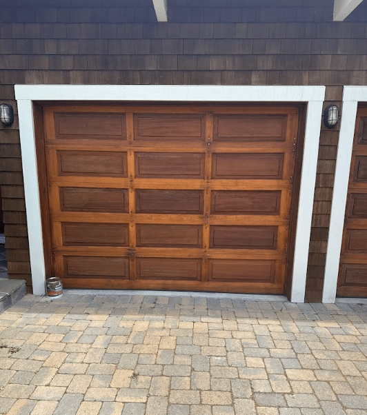 Garage door wood refinishing project by McCarthy Painting